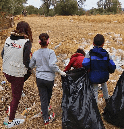 Our students clean up the space around VIAL’s camp